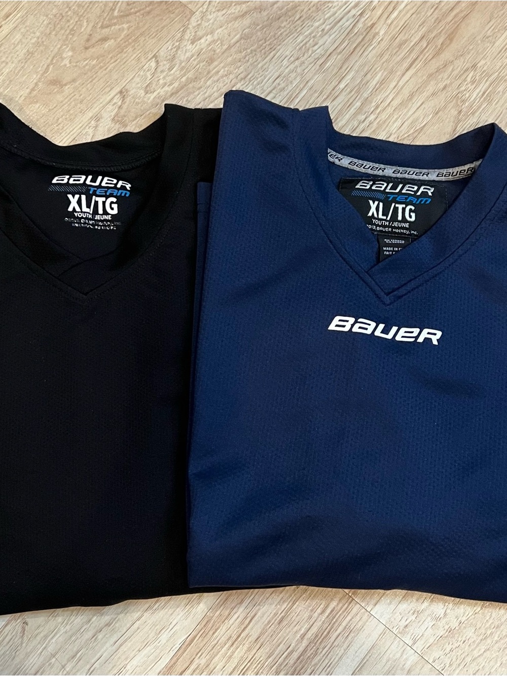 2 Bauer Youth XL Hockey Jerseys, V neck, long sleeves, Black & Navy